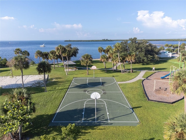 view of basketball court featuring a playground, a gazebo, a water view, and a lawn