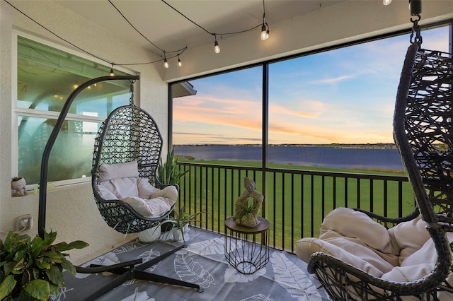 sunroom with a water view