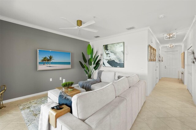 tiled living room with crown molding and ceiling fan with notable chandelier