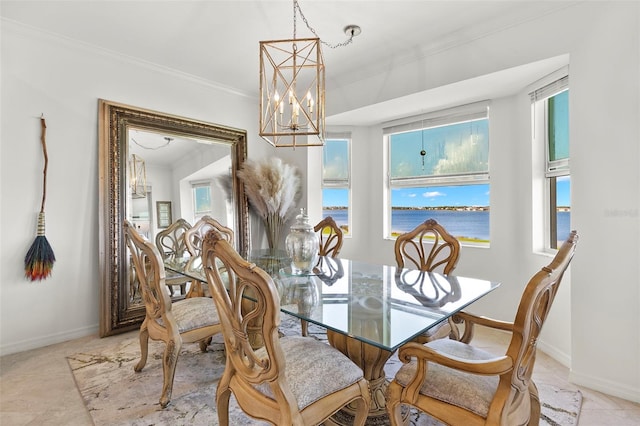 tiled dining area featuring a water view, a notable chandelier, and ornamental molding