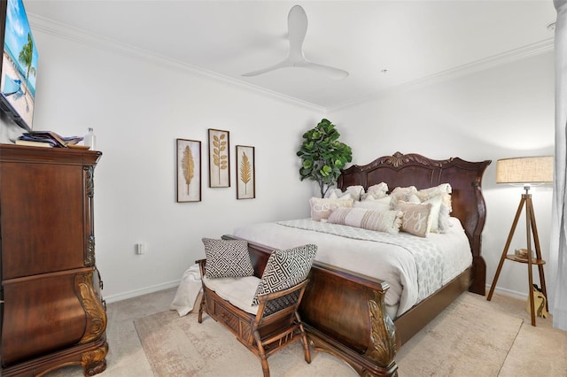 carpeted bedroom with ornamental molding and ceiling fan