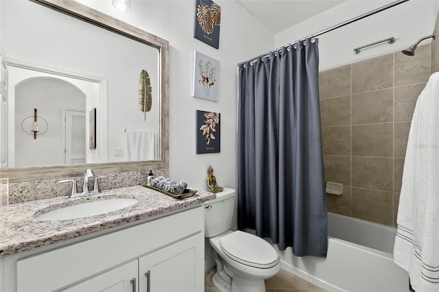 full bathroom with vanity, toilet, tile patterned floors, and shower / tub combo