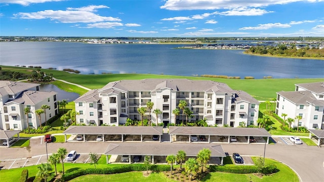 birds eye view of property with a water view