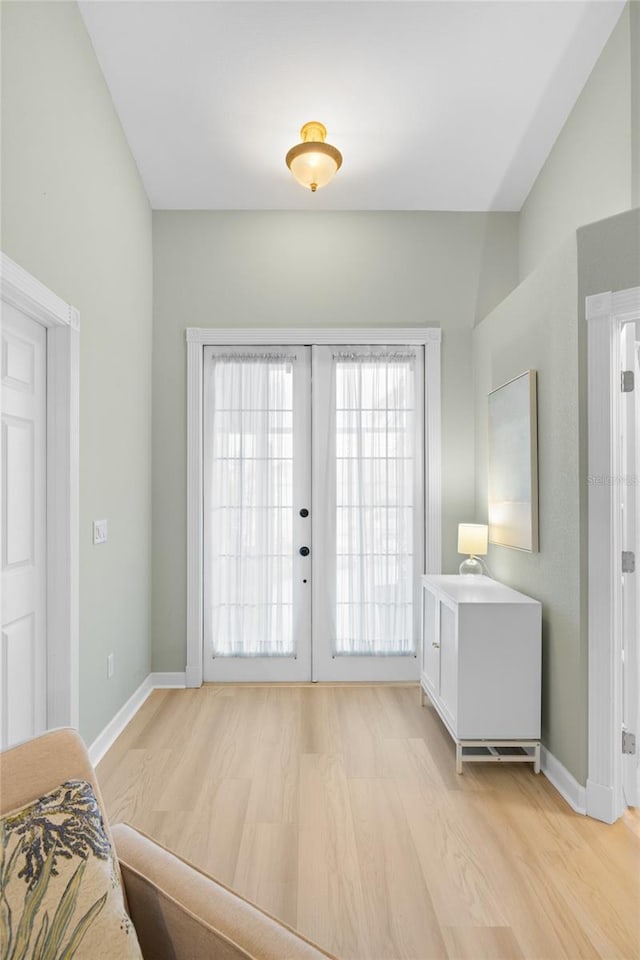 doorway featuring light hardwood / wood-style floors and french doors