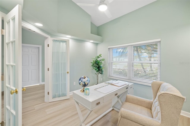 office area with ceiling fan, light hardwood / wood-style floors, and lofted ceiling