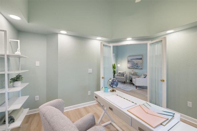 office area with light hardwood / wood-style floors