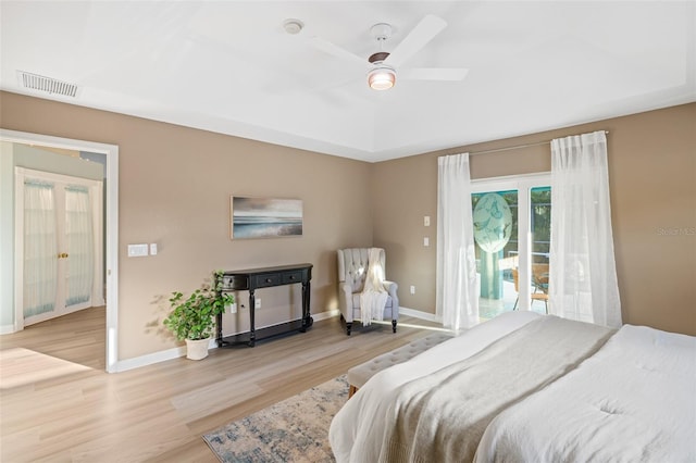 bedroom with access to outside, ceiling fan, and light hardwood / wood-style flooring