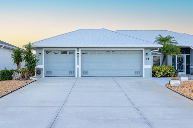 single story home with a garage