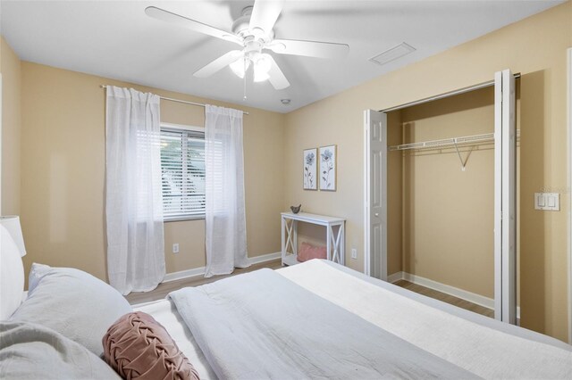 bedroom with a closet, ceiling fan, and light hardwood / wood-style floors