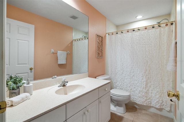 bathroom with tile patterned floors, vanity, curtained shower, and toilet