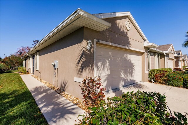 view of side of property with a garage