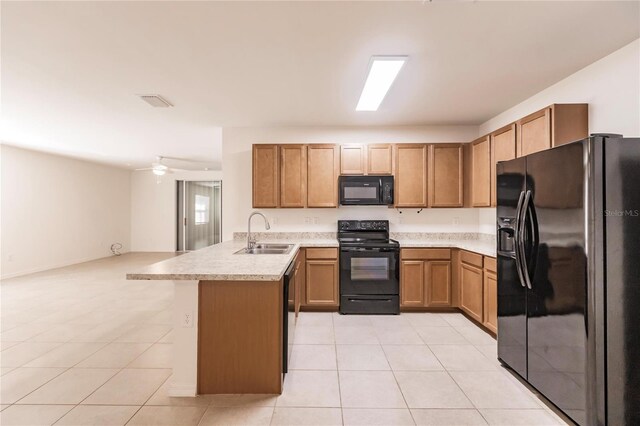 kitchen featuring kitchen peninsula, sink, black appliances, light tile patterned flooring, and ceiling fan