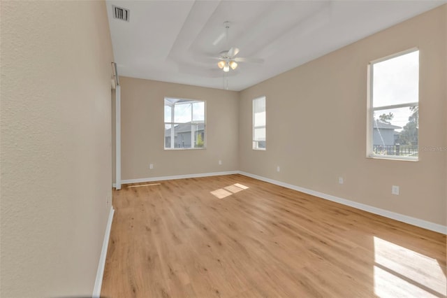 empty room with ceiling fan and light wood-type flooring