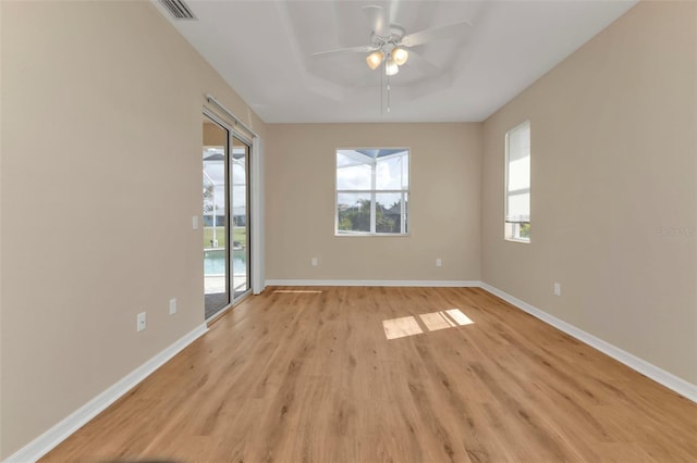 spare room with ceiling fan and light hardwood / wood-style floors