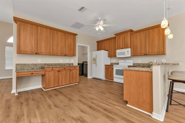 2262 Rio De Janeiro Ave, Punta Gorda, FL 33983 - kitchen featuring white appliances, light wood finished floors, a peninsula, a ceiling fan, and brown cabinets
