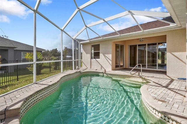 view of pool featuring ceiling fan, a lanai, and a patio