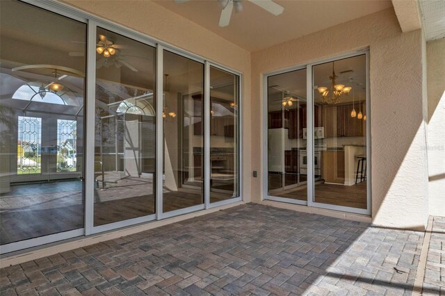 2262 Rio De Janeiro Ave, Punta Gorda, FL 33983 - doorway to property with ceiling fan and stucco siding