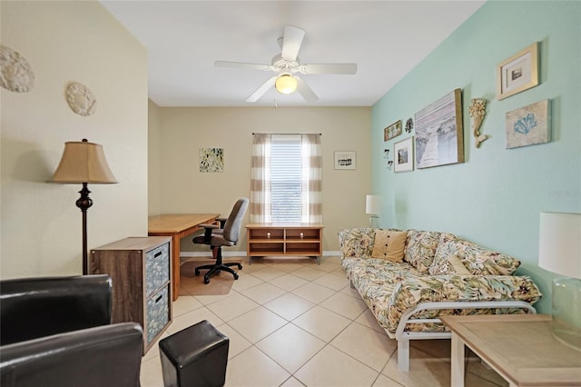 tiled home office featuring ceiling fan