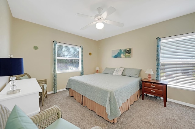 bedroom featuring light colored carpet and ceiling fan