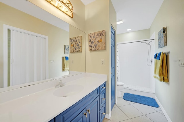 bathroom featuring toilet, vanity, a shower with shower curtain, and tile patterned flooring