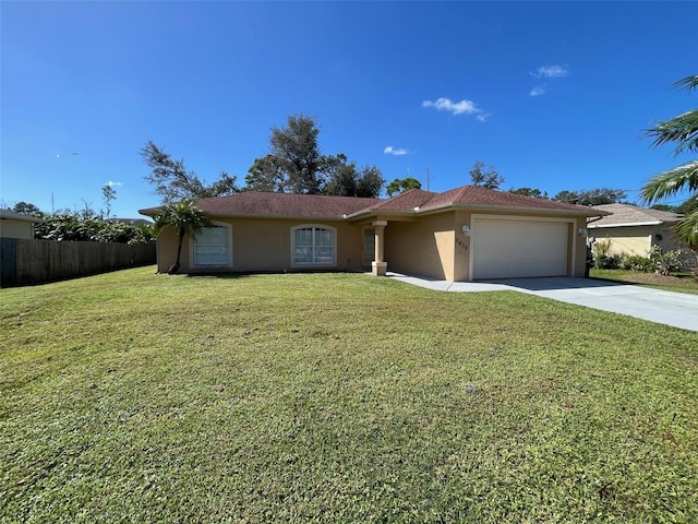 view of front of house featuring a front yard and a garage