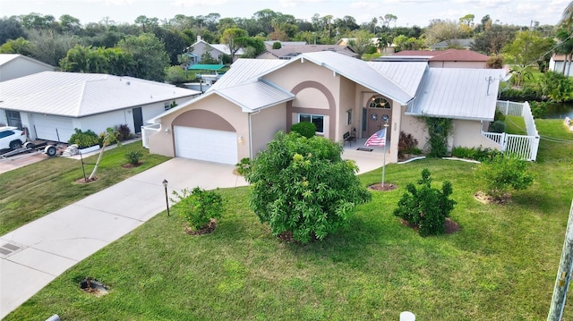 view of front facade featuring a garage and a front lawn