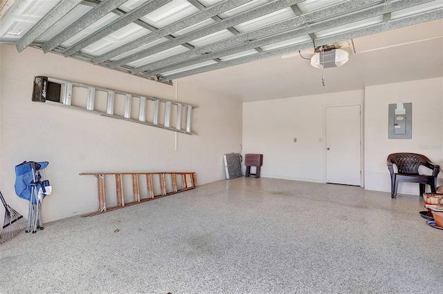 garage featuring a garage door opener and electric panel