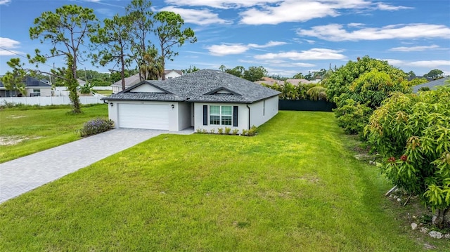 ranch-style house featuring a front yard and a garage