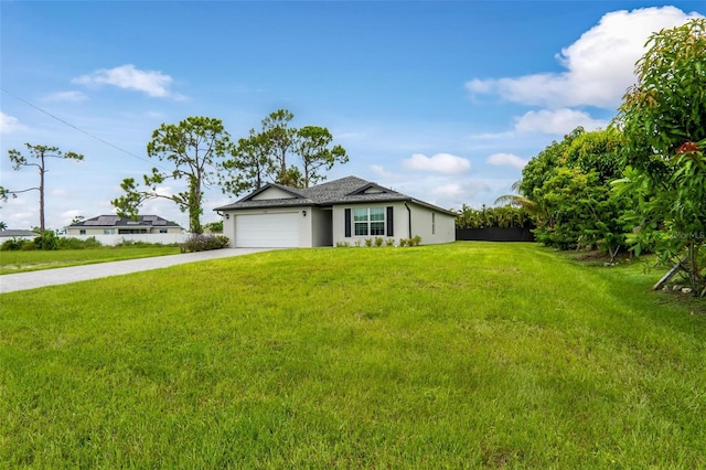 view of front facade with a front yard and a garage