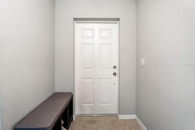 entryway featuring light tile patterned flooring