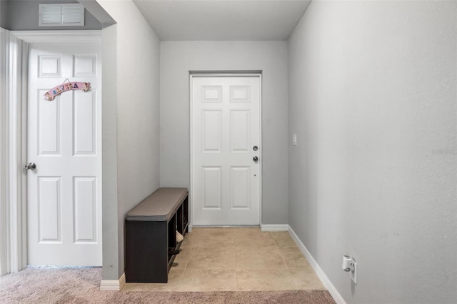 entryway featuring light tile patterned floors