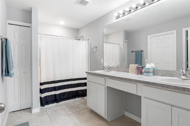 bathroom featuring vanity, tile patterned floors, and a shower with curtain