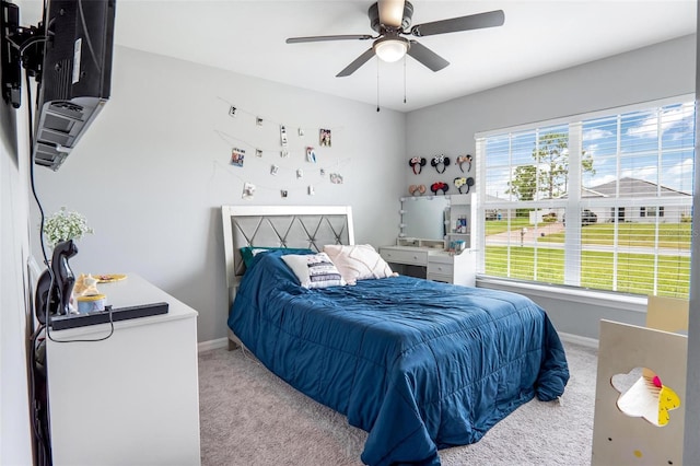 bedroom with light colored carpet and ceiling fan