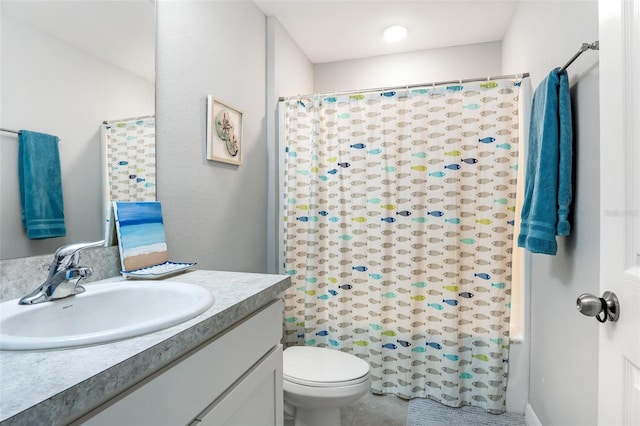 bathroom with vanity, toilet, and a shower with curtain