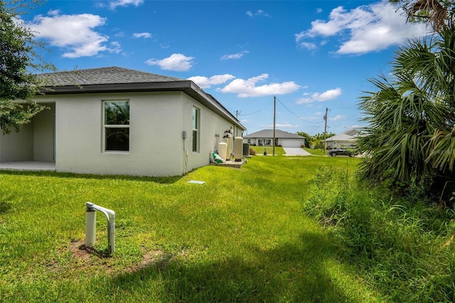 view of yard featuring a garage