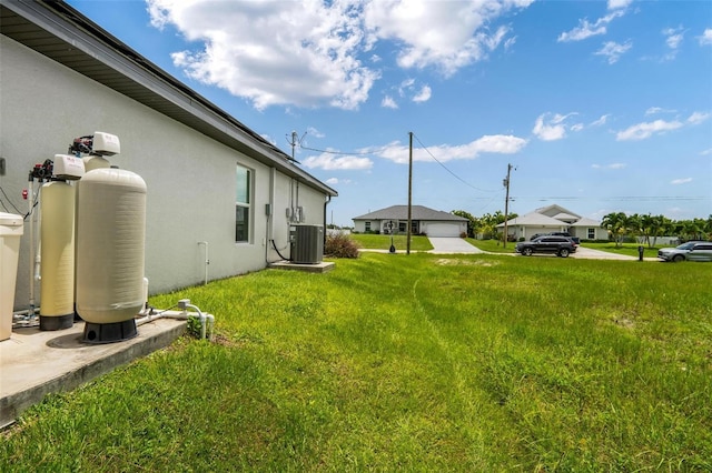 view of yard with central AC unit