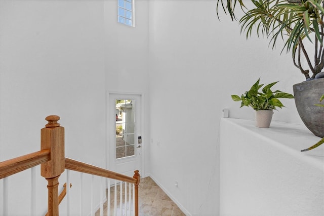 14640 Sycamore Ct Unit 2822, Punta Gorda, FL 33955 - corridor featuring plenty of natural light, a high ceiling, and light tile patterned flooring