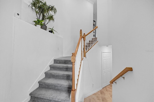 stairway featuring tile patterned floors