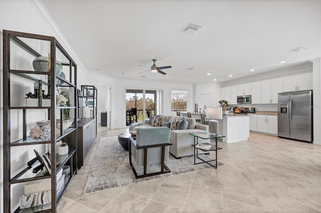 14640 Sycamore Ct Unit 2822, Punta Gorda, FL 33955 - living area featuring crown molding, a ceiling fan, light tile patterned floors, and recessed lighting