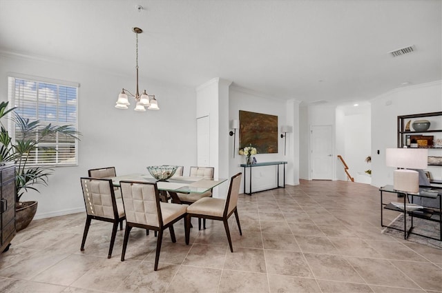 dining space with a chandelier, light tile patterned floors, and ornamental molding