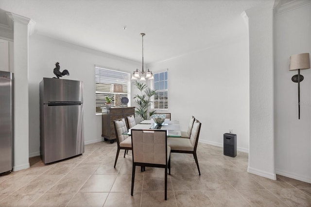 dining space with a chandelier, light tile patterned floors, and ornamental molding