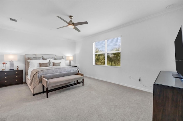 bedroom with ceiling fan, light carpet, and crown molding