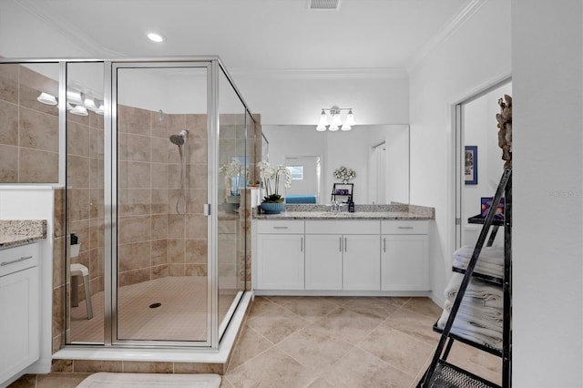 bathroom featuring ornamental molding, tile patterned flooring, an enclosed shower, and vanity