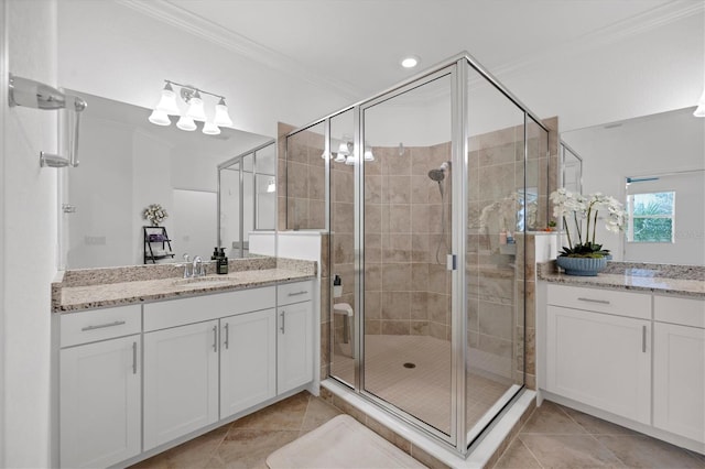 bathroom featuring tile patterned floors, an enclosed shower, and crown molding