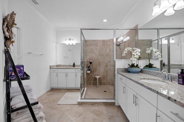 bathroom featuring walk in shower, tile patterned flooring, vanity, and crown molding