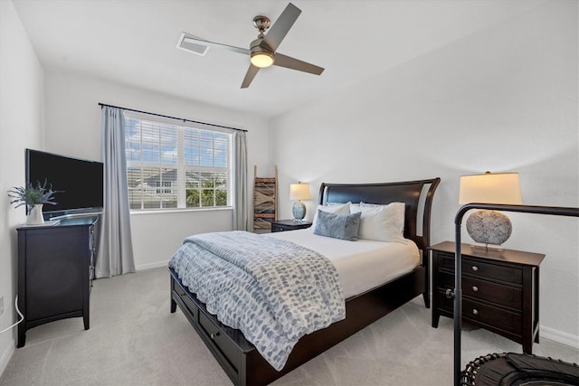 bedroom featuring light carpet and ceiling fan