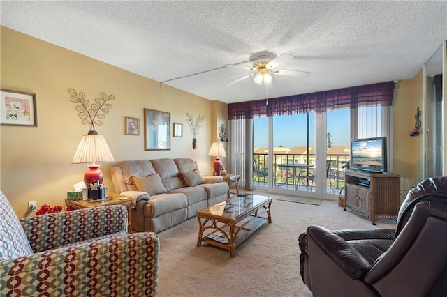 25188 Marion Ave Unit B304, Punta Gorda, FL 33950 - carpeted living room featuring ceiling fan and a textured ceiling
