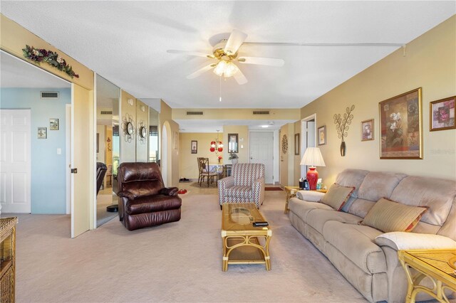25188 Marion Ave Unit B304, Punta Gorda, FL 33950 - living room featuring carpet flooring, visible vents, and a ceiling fan