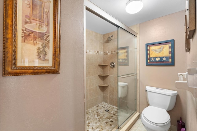 25188 Marion Ave Unit B304, Punta Gorda, FL 33950 - full bathroom featuring a stall shower, toilet, and a textured wall