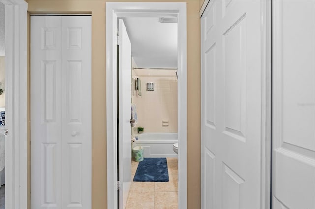 corridor with light tile patterned floors